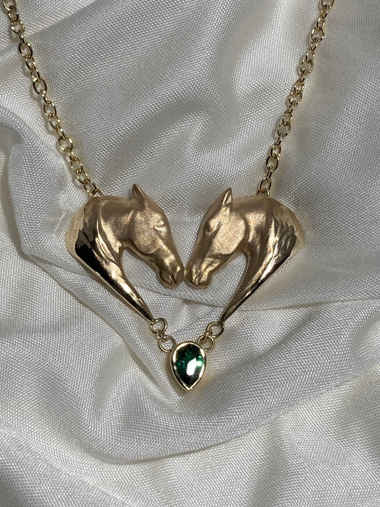 Crafted in solid 14k gold, the Corteggiando Double Horse Head Pendant depicts a mare and stallion in a timeless expression of equestrian beauty, romance, and artistry.
