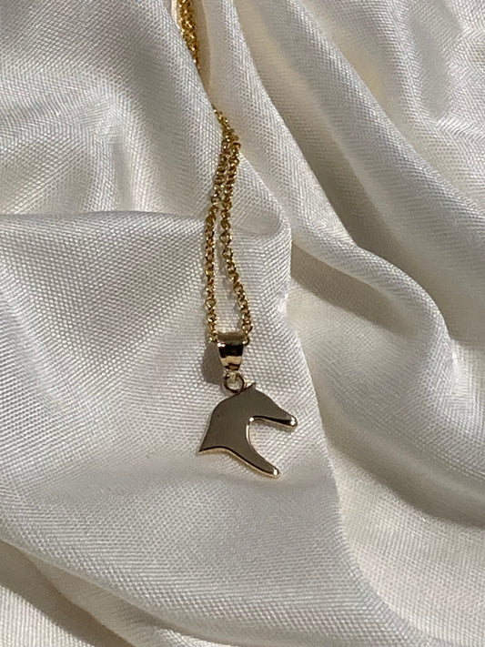 Handcrafted in solid 14k gold, the Horse Head Silhouette Pendant captures the grace and spirit of the horse in a timeless equestrian design by Salina Ramsay.