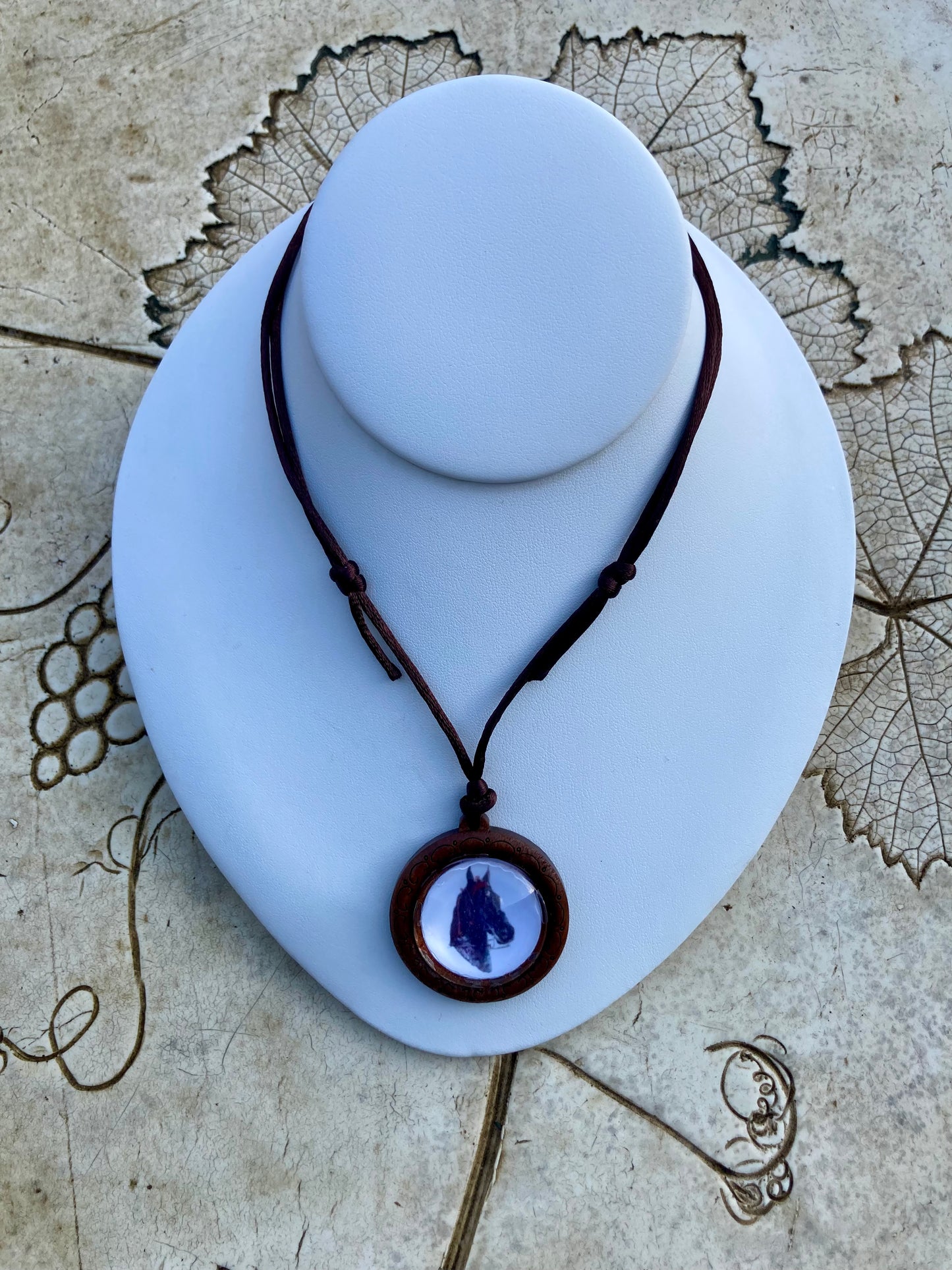 “Dreamie” WGC Garland’s Dream Crystal Pendant featuring Salina Ramsay’s American Saddlebred portrait under crystal, displayed on a white necklace bust.