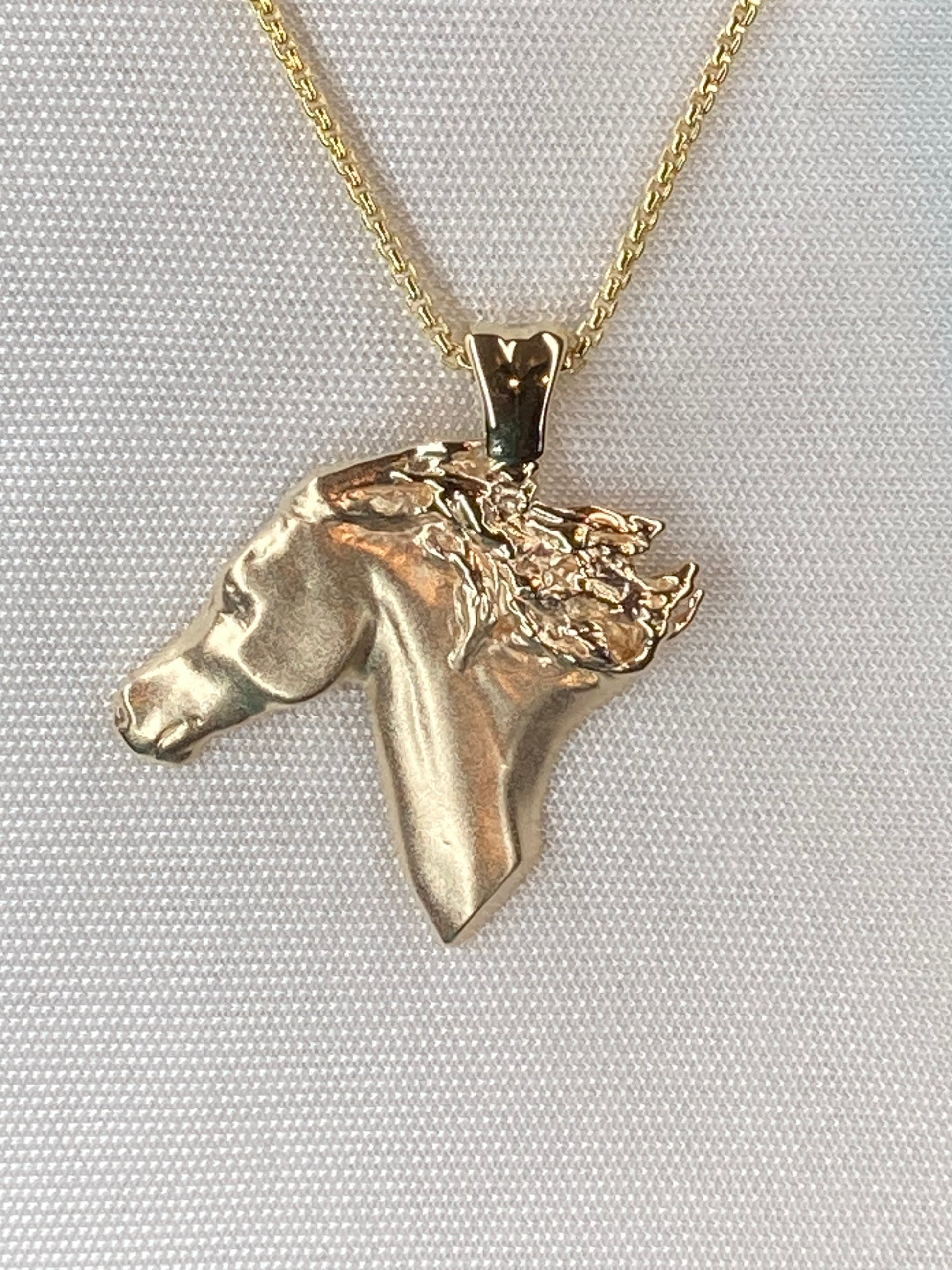Wild. Fierce. Untamed. Sculpted in solid 14k gold, the Selvaggia Horse Head Pendant captures the free spirit, strength, and timeless beauty of the horse.