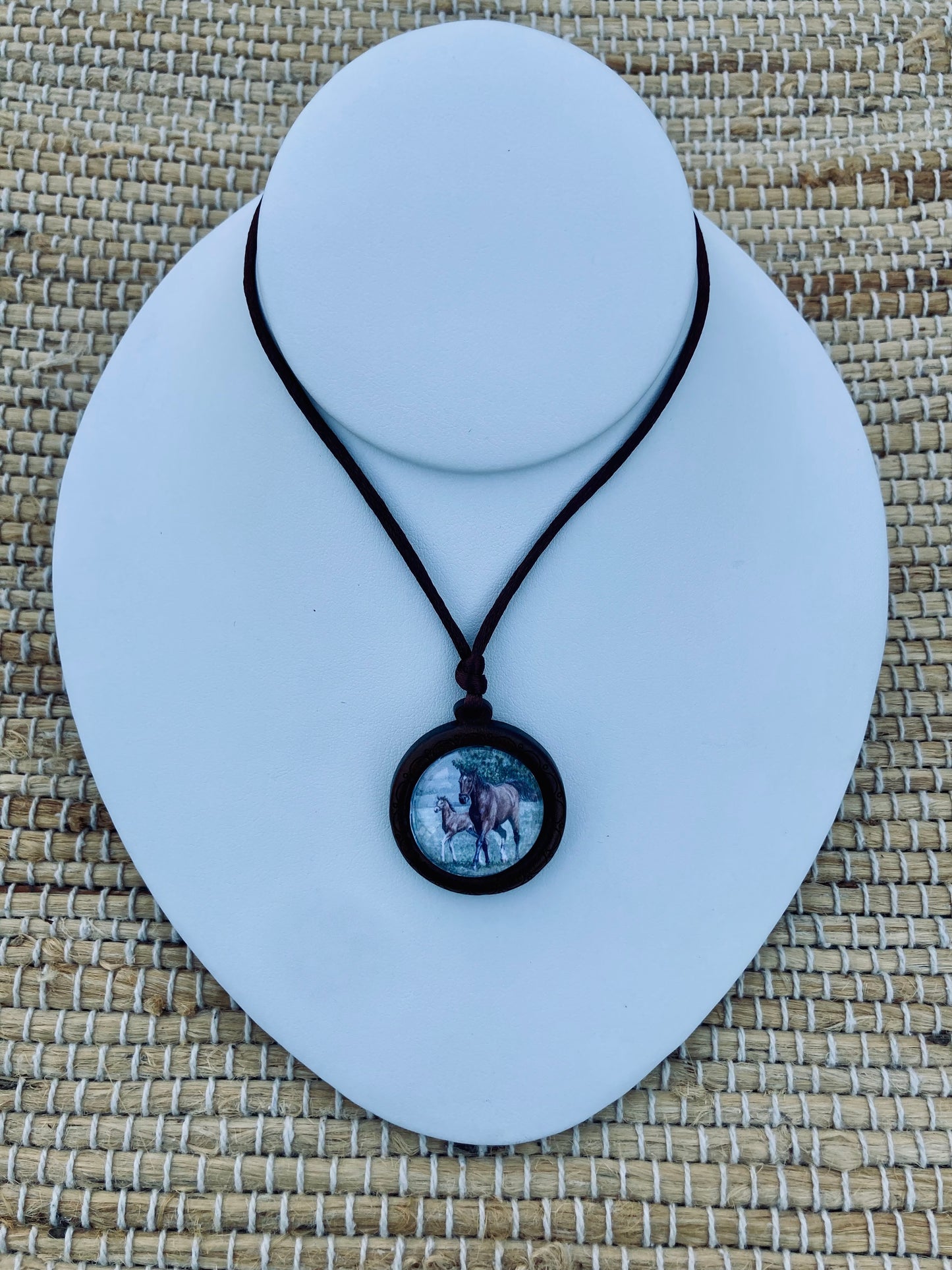 Mother's Day Equestrian Keepsake pendant featuring original artwork by Salina Ramsay of a mare and foal beneath a crystal setting, symbolizing the timeless bond between mother and child.
