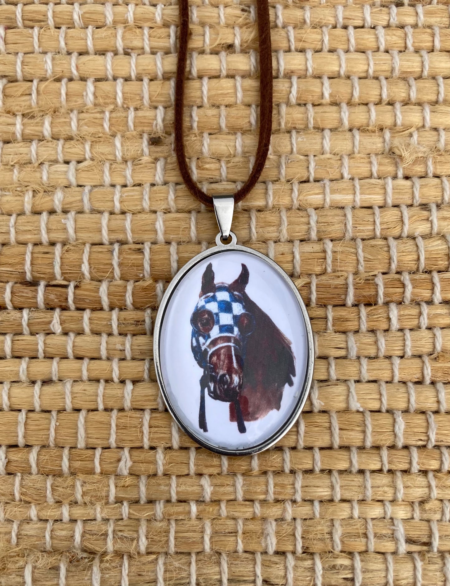 Secretariat Crystal Pendant featuring original equestrian artwork by Salina Ramsay beneath a crystal dome.