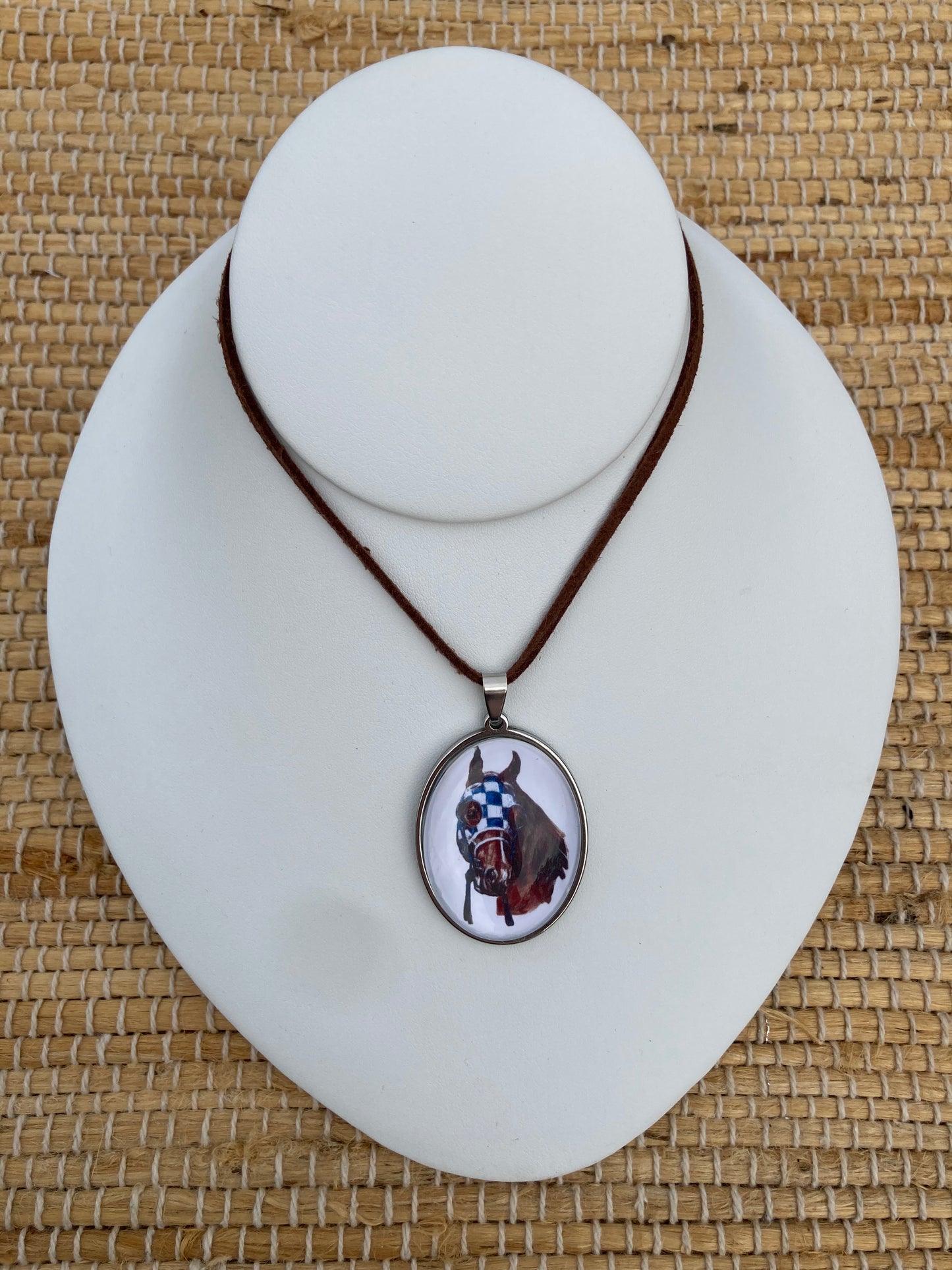Secretariat Crystal Pendant featuring original equestrian artwork by Salina Ramsay beneath a crystal dome, inspired by the legendary Triple Crown champion. Shown on bust.