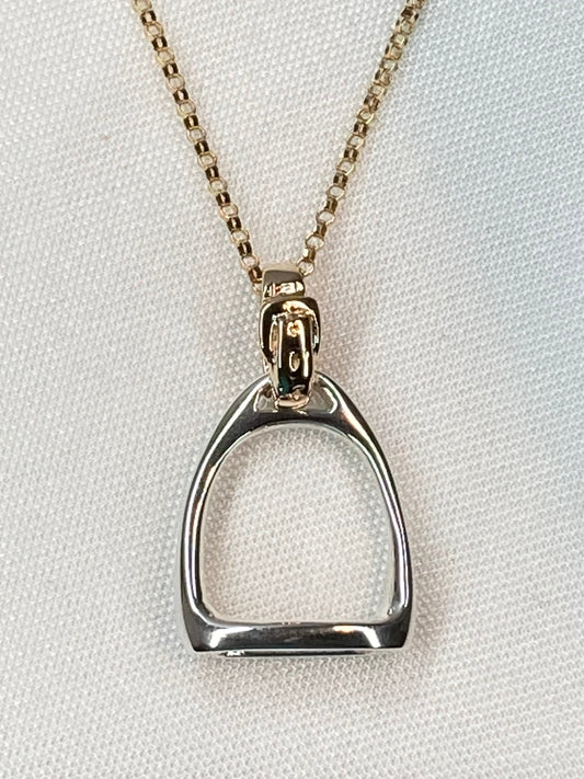 Equestrian Stirrup Pendant by Salina Ramsay, inspired by the classic English stirrup and the enduring partnership between horse and rider. This sculptural design symbolizes balance, trust, and the traditions of the sporting life.