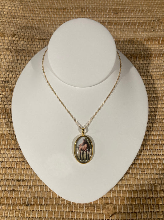 The Filly equestrian art pendant in gold vermeil featuring original horse artwork by Salina Ramsay beneath a crystal dome.